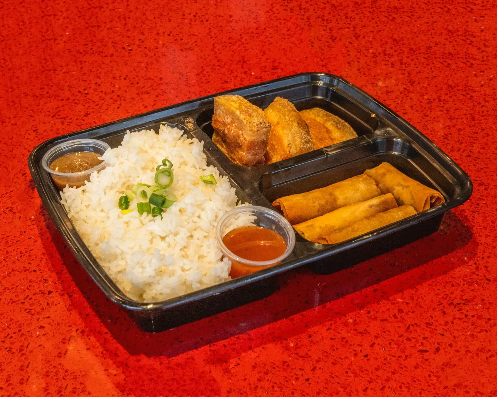 Casa Manila bento — rice, vegetables and protein packed in a take-home box